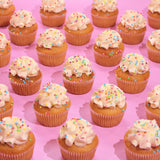 Vegan Vanilla Cupcakes with smooth plant-based icing and colorful sprinkles, freshly baked by Crumbs & Doilies.